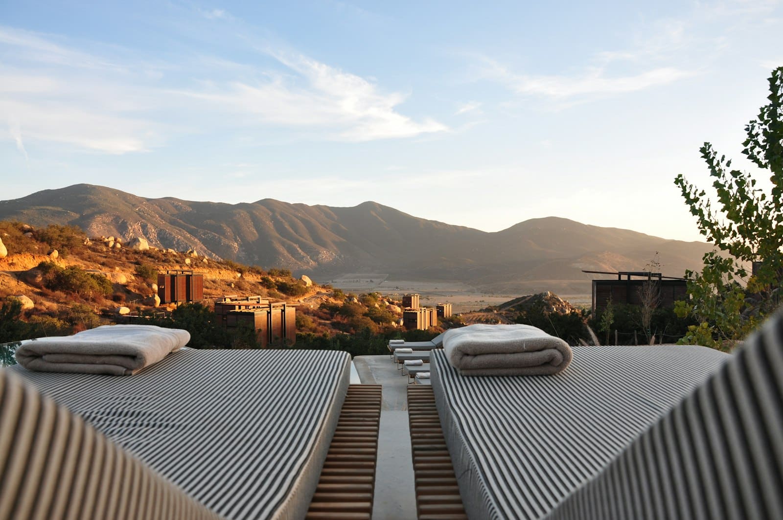 Quiet luxury hospitality terrace for guests awaiting coordinated arrangements