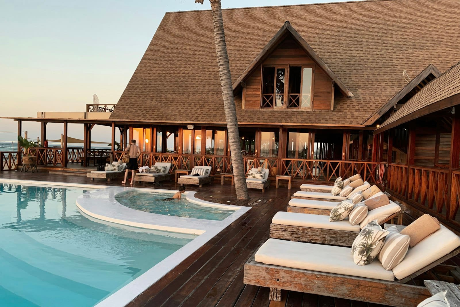 Luxury resort pool overlooking tropical coastline